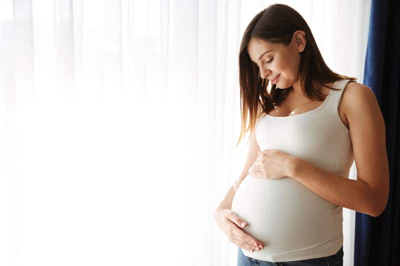 minimum age for surrogate mother